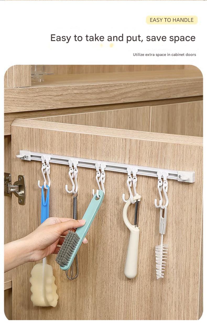 Close-up of sliding hook rack with kitchen utensils