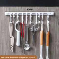 Kitchen cabinet with organised utensils on hook rack