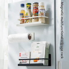 Magnetic paper towel holder mounted on fridge
