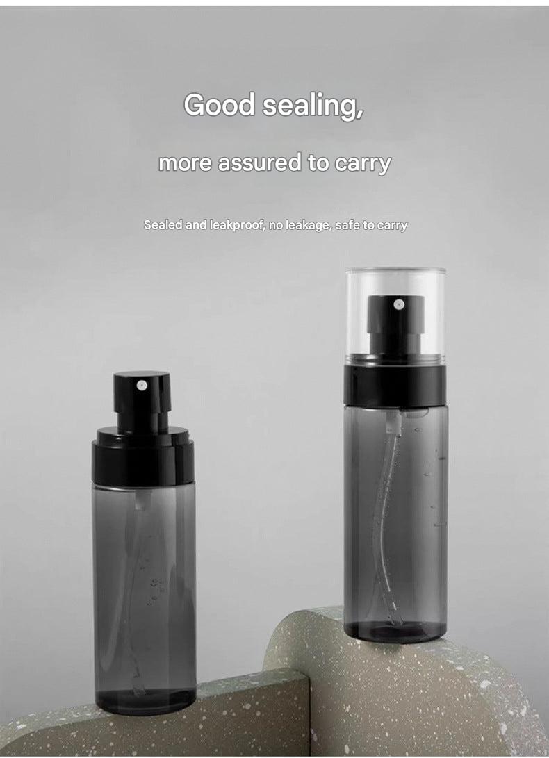 Portable hydration spray bottle on a travel backdrop