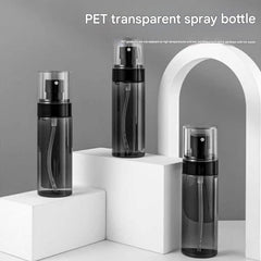 Fine mist facial spray bottle in a travel setting
