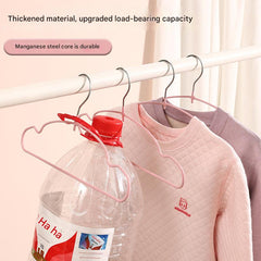 Stylish children's hangers displayed on a rack