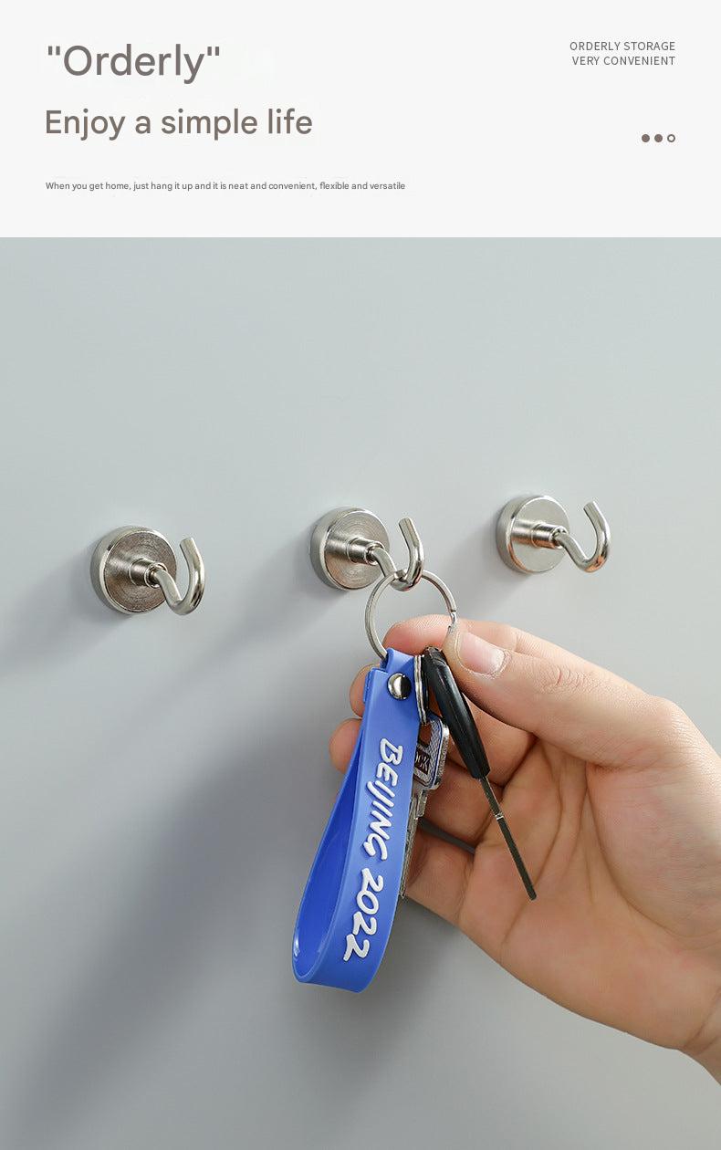 Magnetic hook holding kitchen utensils