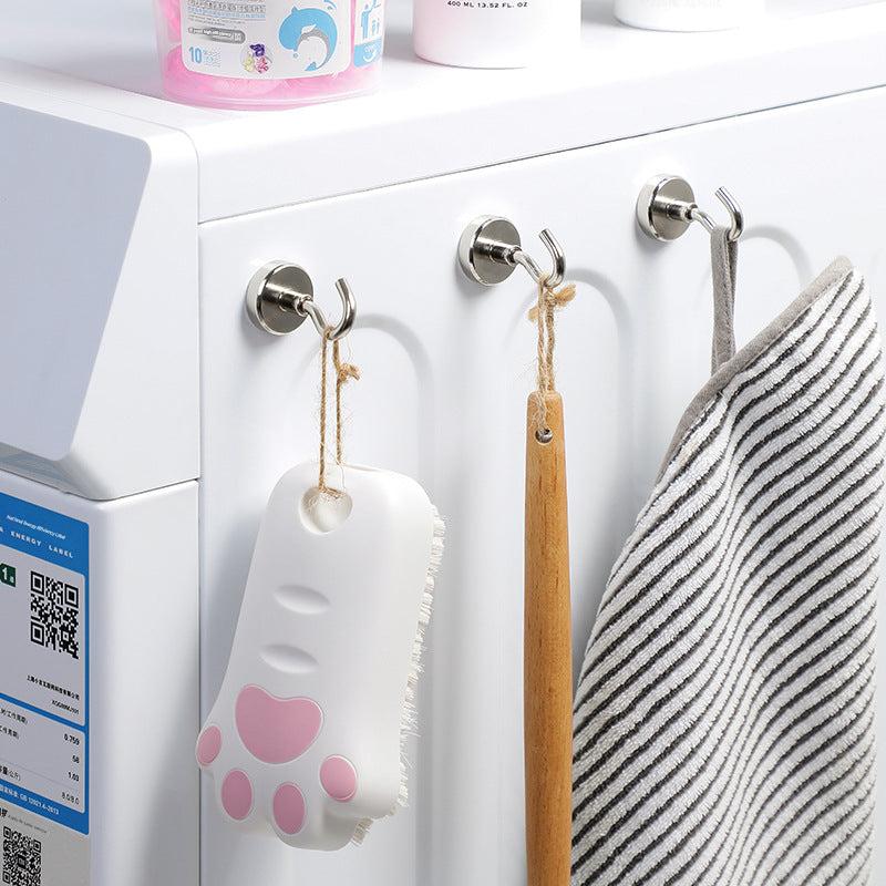 Magnetic hook holding kitchen utensils