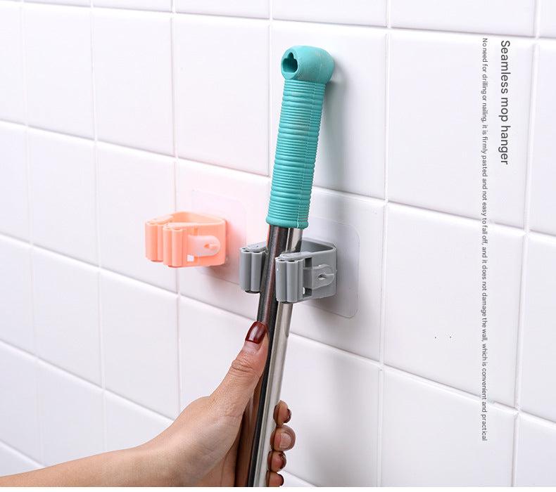 Compact mop holder for small spaces