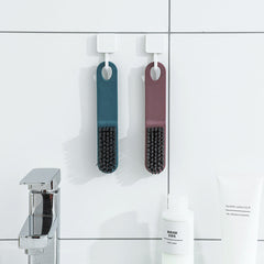 Cleaning brush in action during a laundry task - image 4