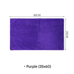 Microfiber cleaning cloth in use on glass surface