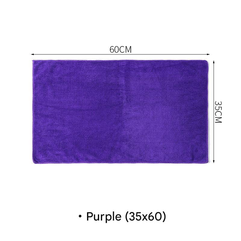 Microfiber cleaning cloth in use on glass surface