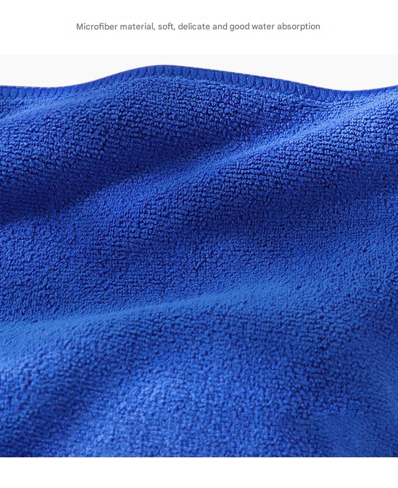 Microfiber cleaning cloth in use on glass surface