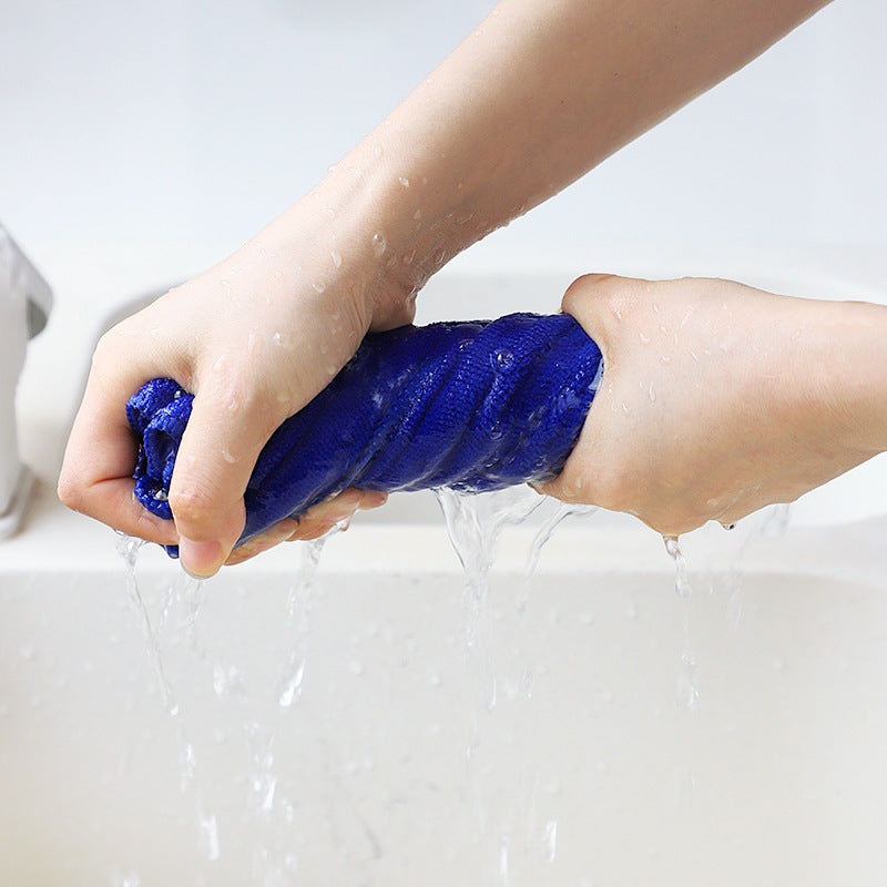 Purple microfiber cleaning cloth with cleaning supplies