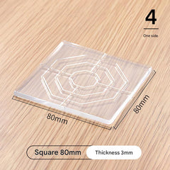 Clear silicone furniture leg pads on wood floor