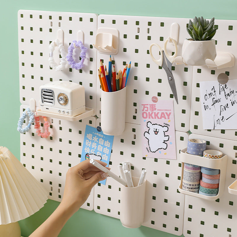 Wall-mounted pegboard organiser with compartments photo