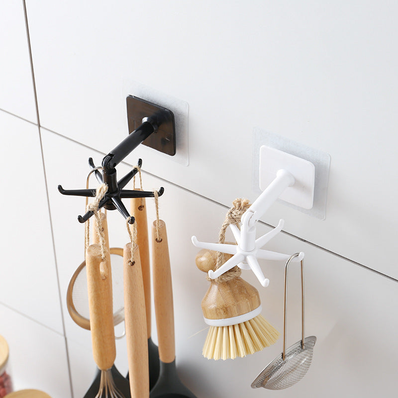 black adhesive hook holding utensils
