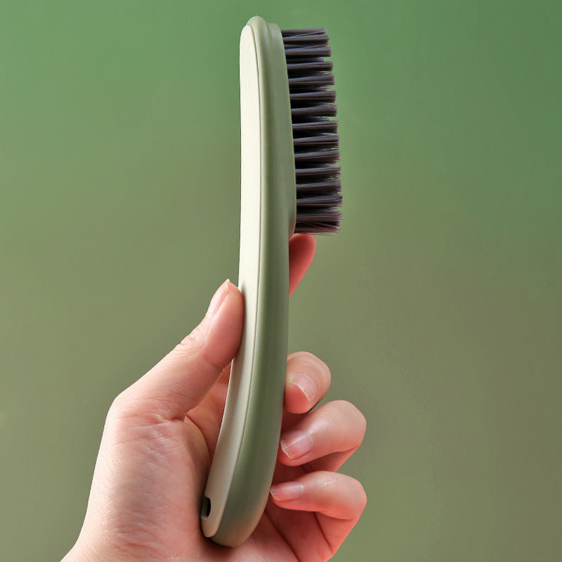 Shoe cleaning brush demonstrating ergonomic handle