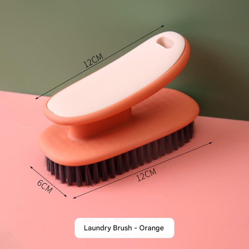 Hand holding the multifunctional shoe cleaning brush