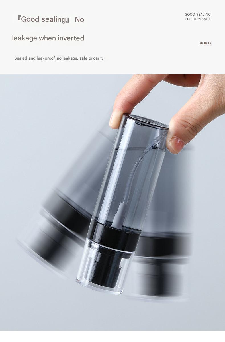 Travel spray bottle with ergonomic design