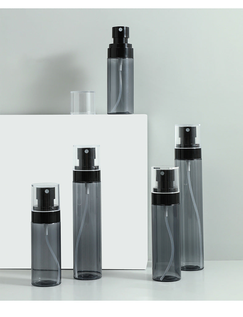 Various angles of a travel-friendly spray bottle