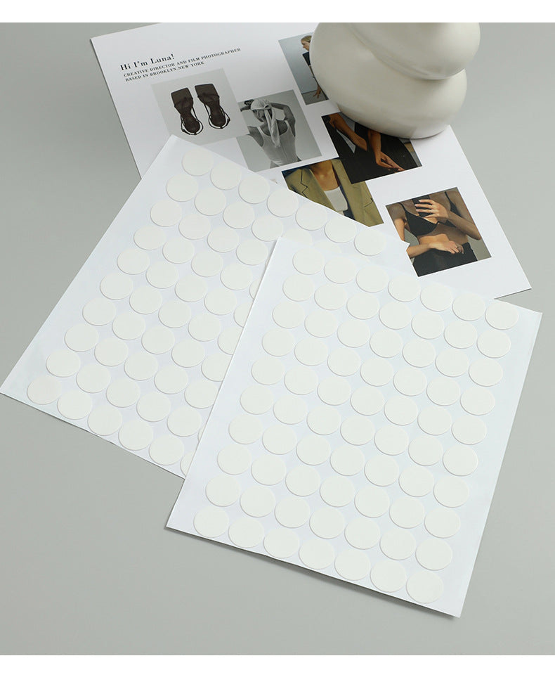 Multiple adhesive dots on a surface