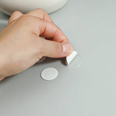 Close-up of reusable acrylic adhesive dots