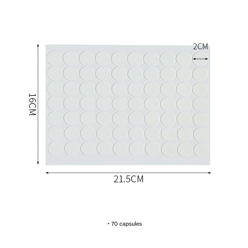 Multiple adhesive dots on a surface
