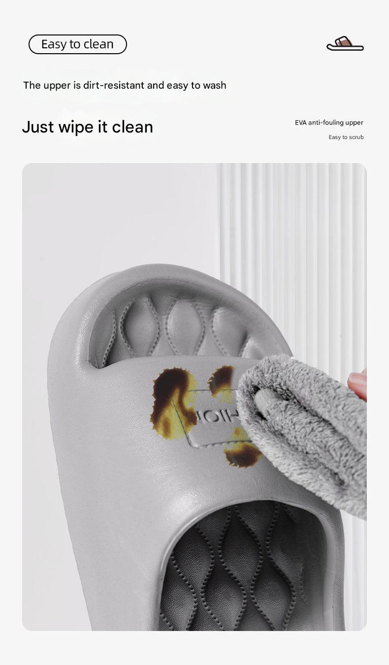 Pair of unisex anti-slip slippers on a floor
