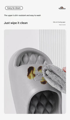 Pair of unisex anti-slip slippers on a floor