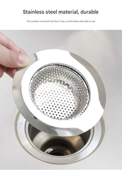 Close-up of stainless steel kitchen sink strainer on counter