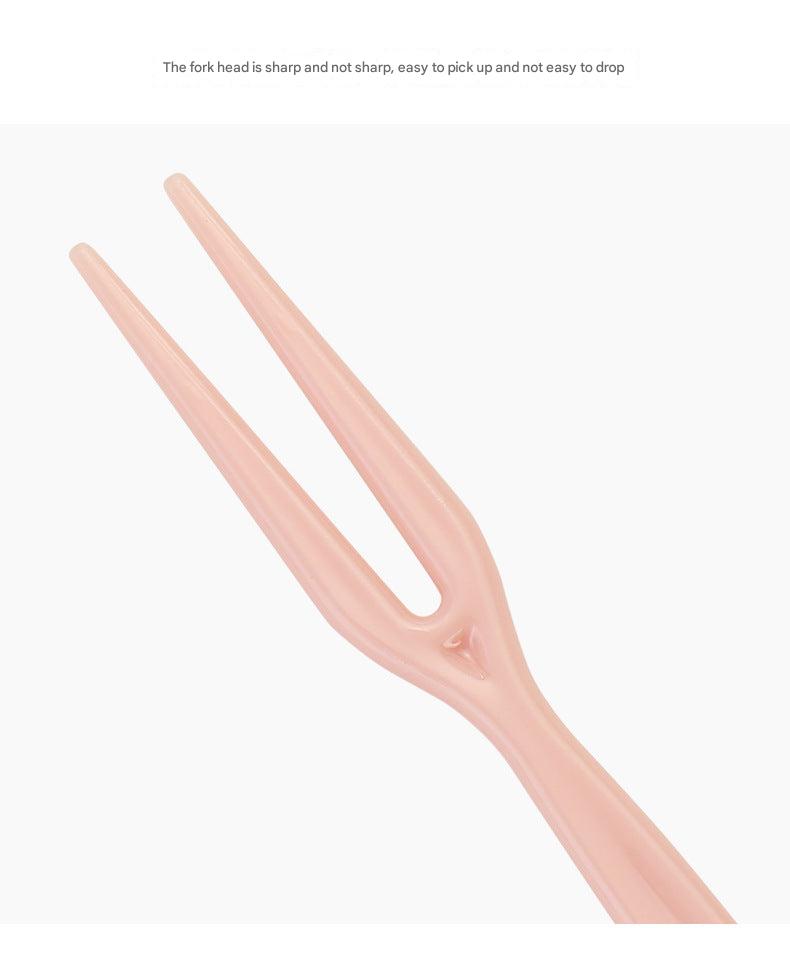 close up image of colorful disposable forks
