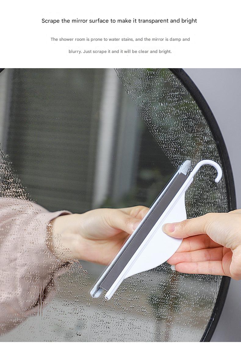 mini squeegee in use on shower doors