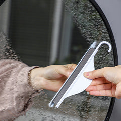 mini squeegee in use on shower doors