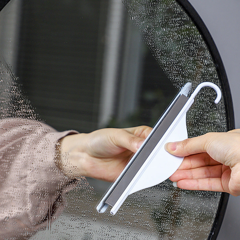 mini squeegee in use on shower doors