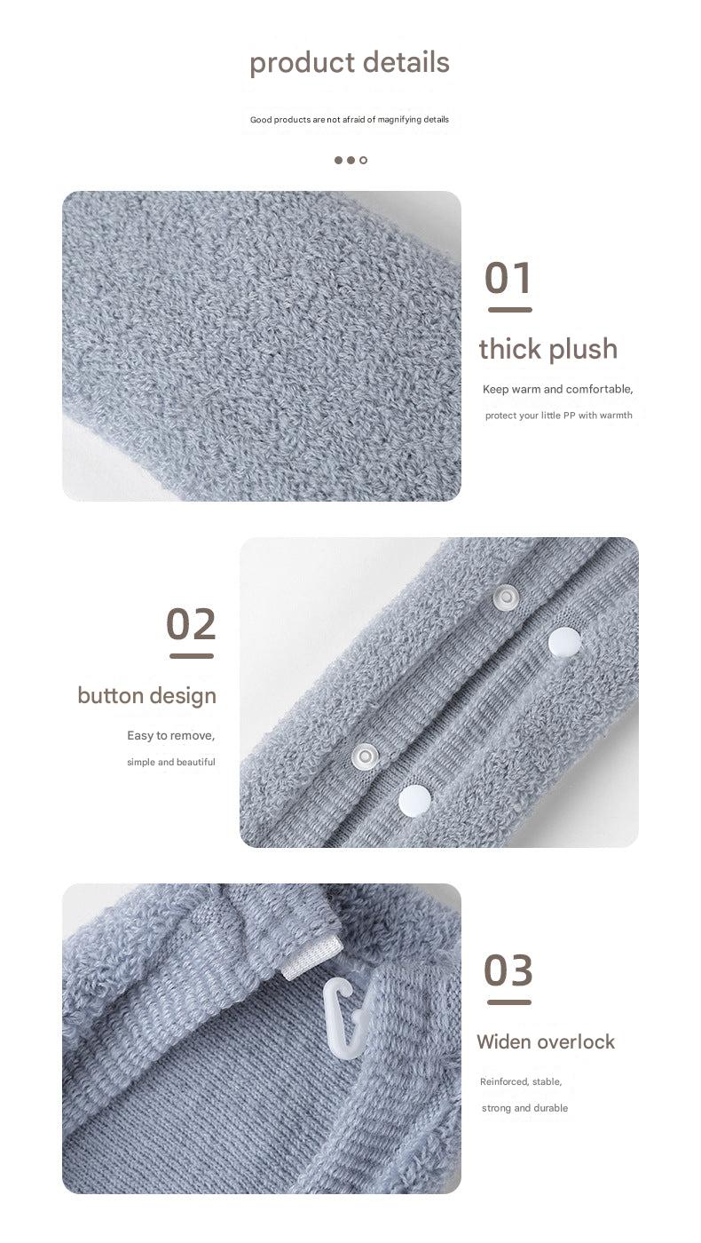 Toilet seat cover in simple bathroom setting