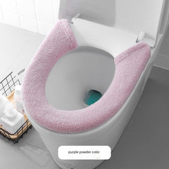 Toilet seat cover in simple bathroom setting