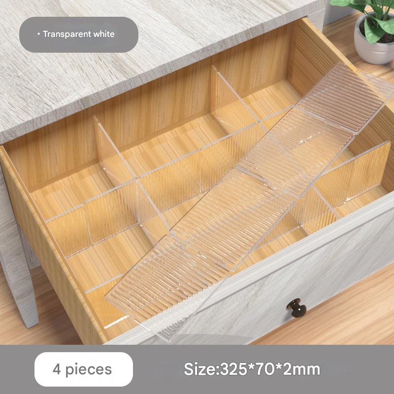 Collection of plastic drawer dividers in various positions
