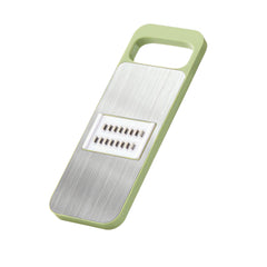 grater with shredded vegetables