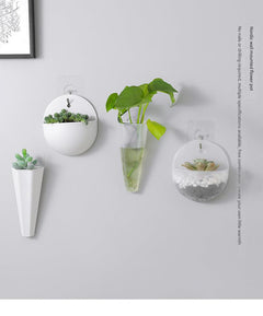 Stylish wall-mounted planter with indoor plants