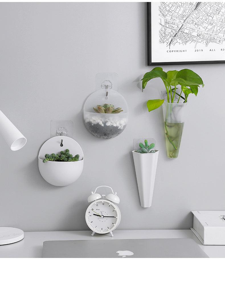Decorative wall-mounted planter showcasing flowers