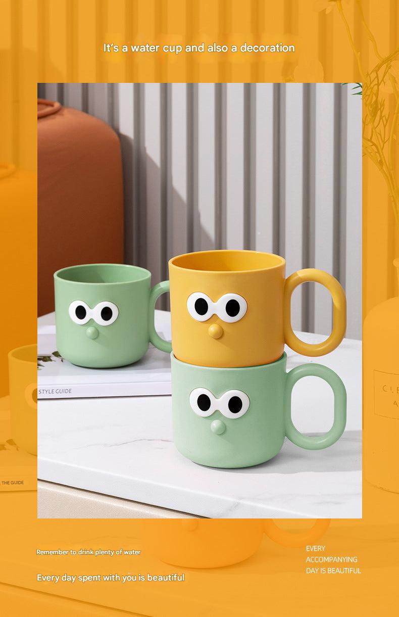 child-friendly toothbrush rinse cup in yellow