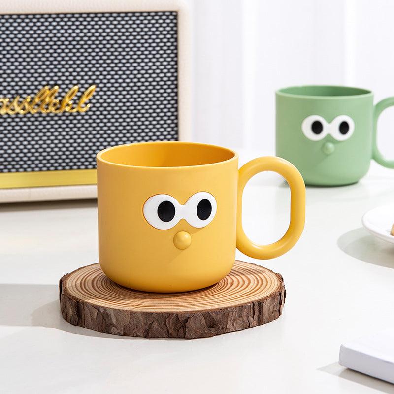 child-friendly toothbrush rinse cup in yellow