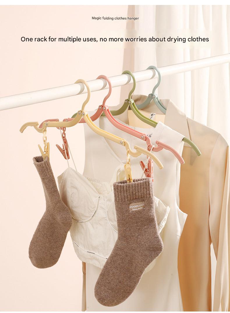 Compact Travel Folding Clothes Hanger in use