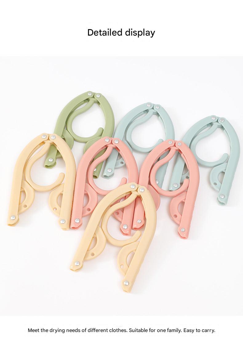 Compact clothes hanger in suitcase