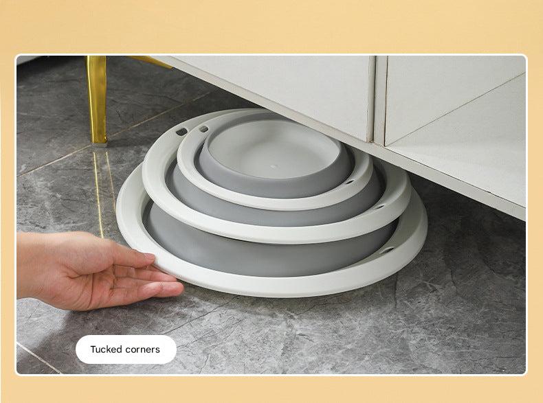 Basin shown in use for washing dishes outdoors