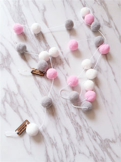 soft ball string decorations in a child's room image 10