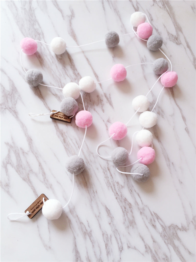 soft ball string decorations in a child's room image 10