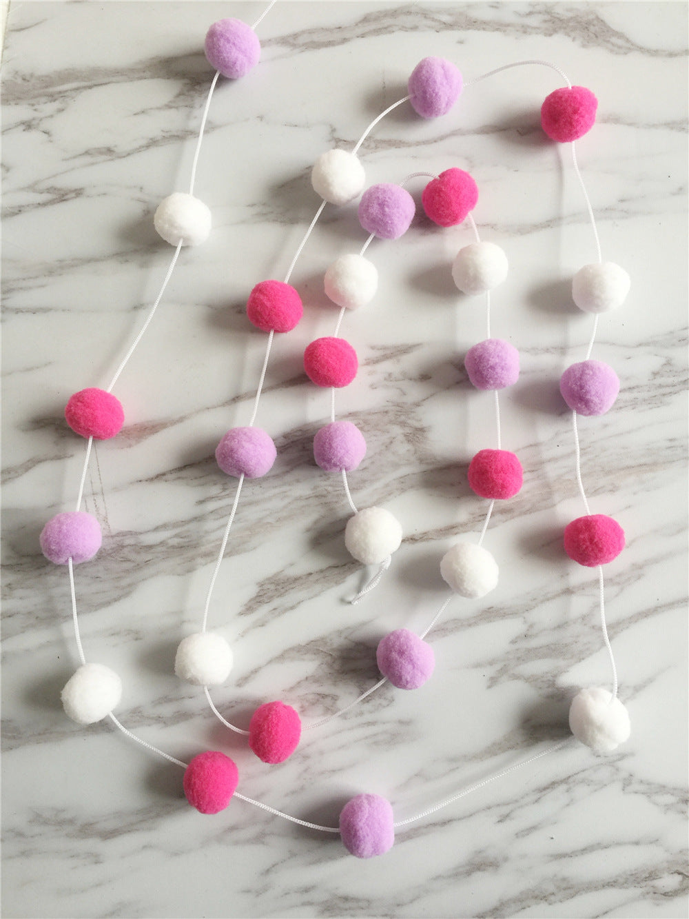 soft ball string decorations in a child's room image 10