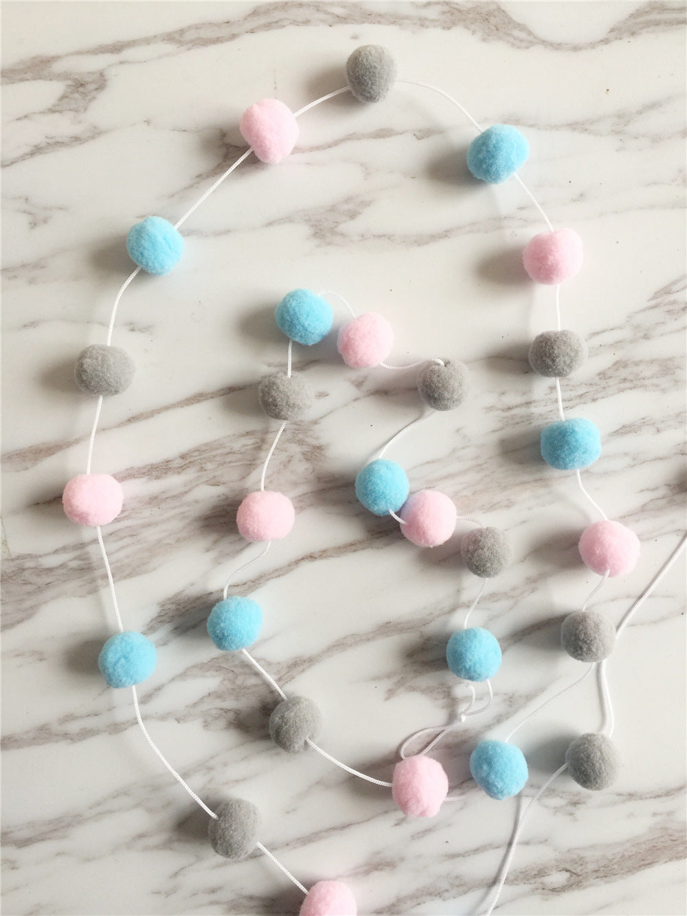 window display with colour ball strings for kids image 8