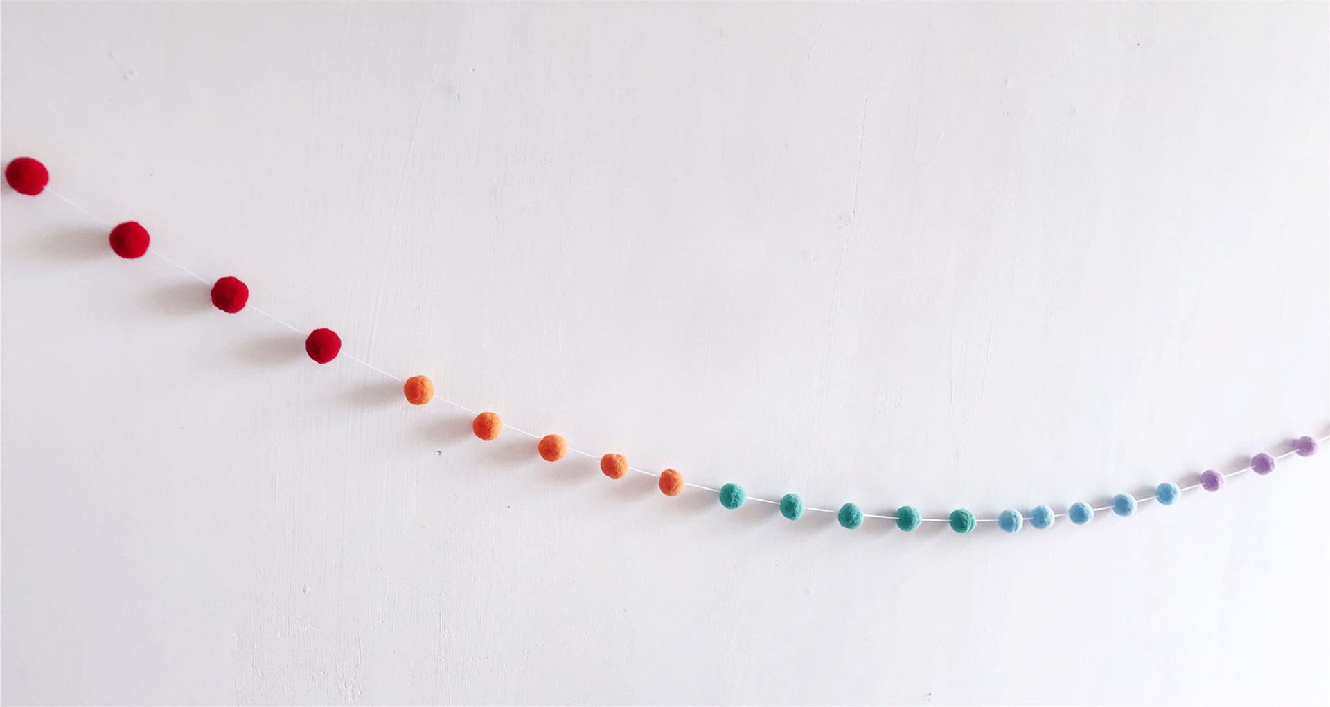 soft ball string decorations in a child's room image 10