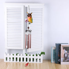 Soothing sounds from owl wind chime in breeze