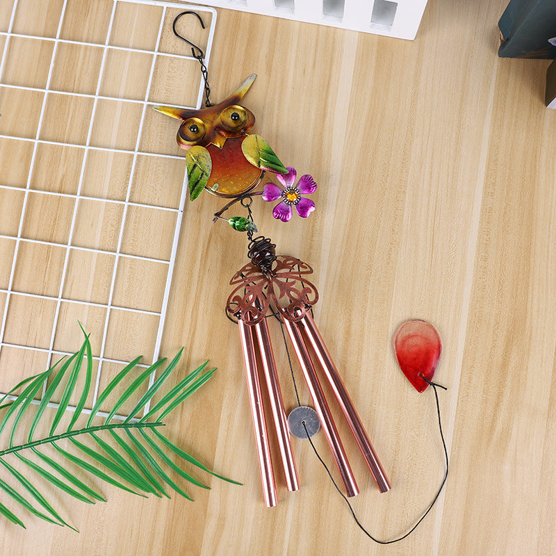 Charming owl wind chime displayed outdoors
