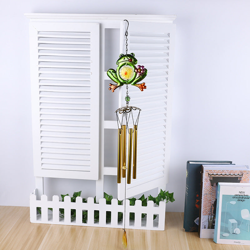 Wind chime featuring frog motifs and glass decor
